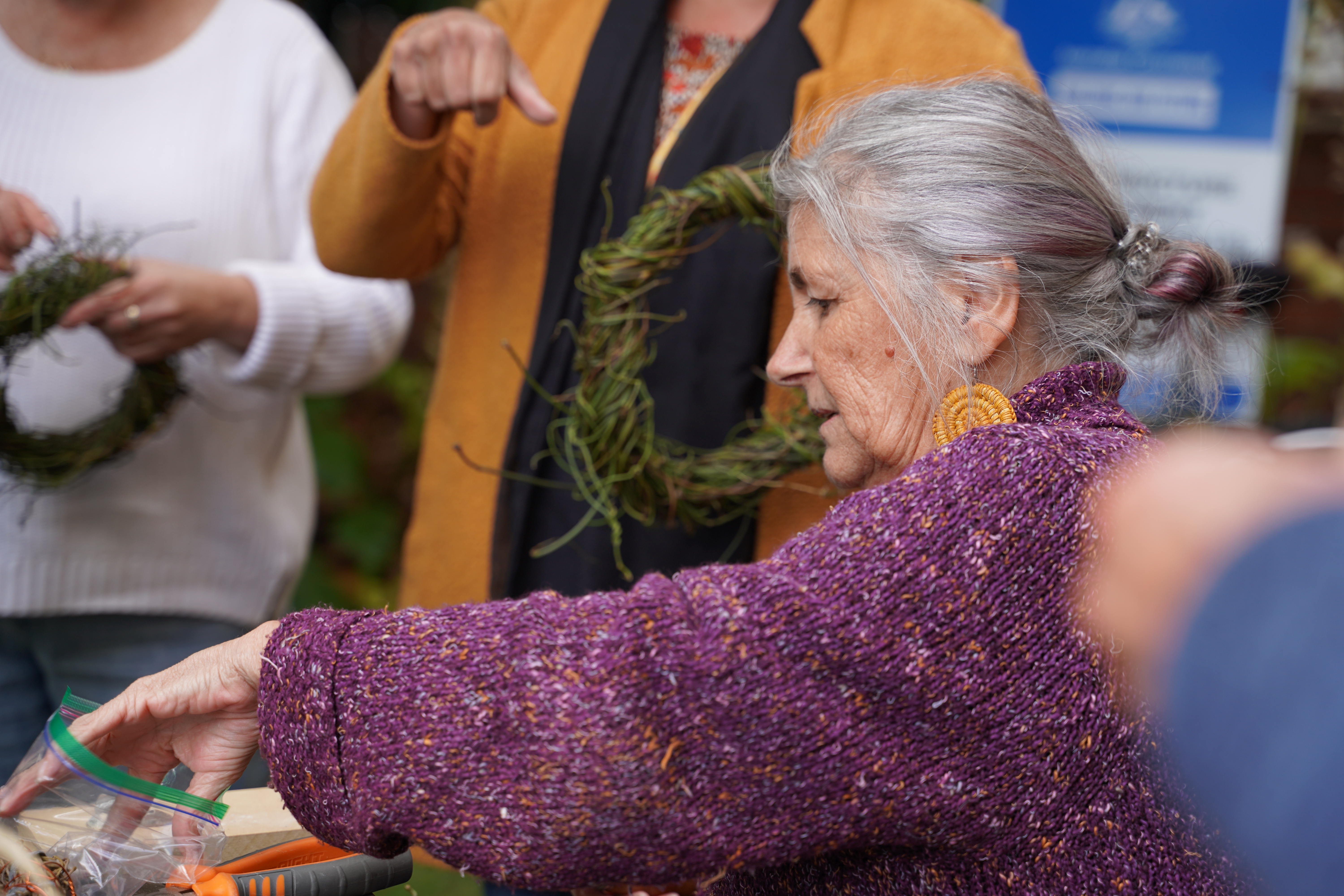 Aunty Vicki West leads a making and yarning circle at QVMAG's International Women's Day 2023 workshop