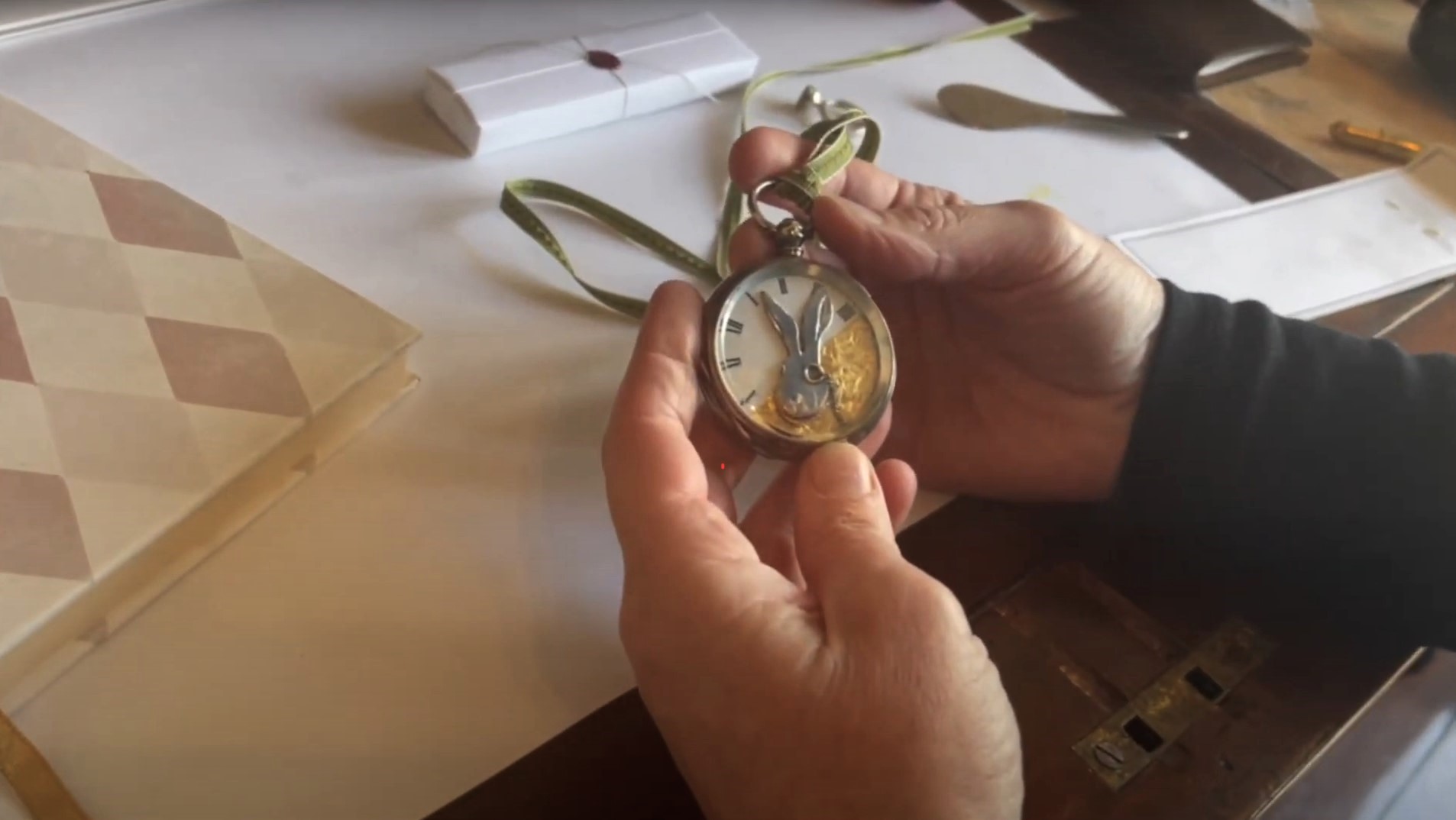 Jeweller Anita Dineen shows a rabbit timepiece in her workshop