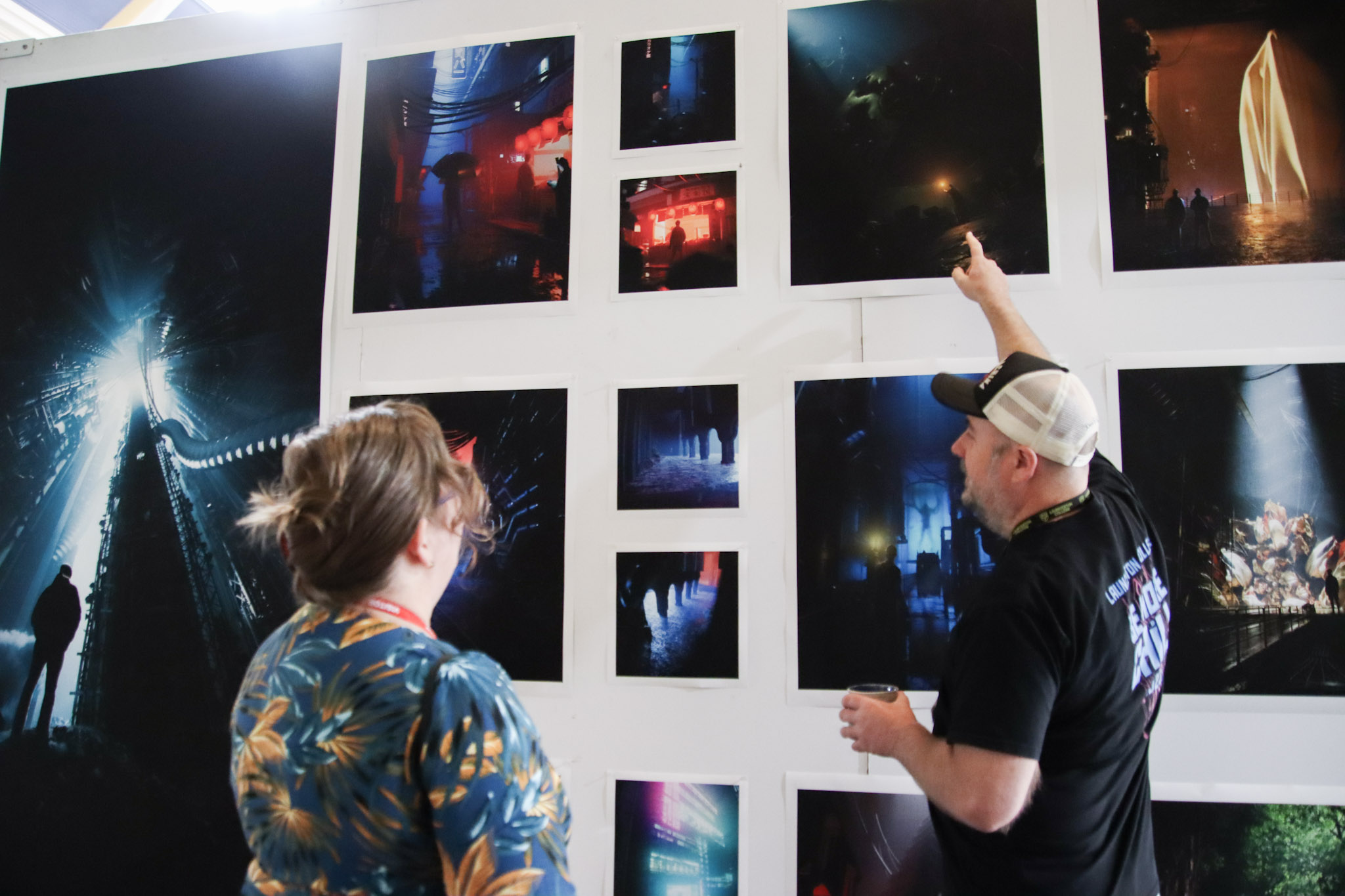 Launceston College art teacher Scott Cunningham speaks to QVMAG curator Kate Davies in front of a student's body of photographic work