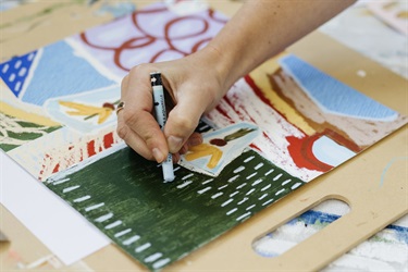 Close up of RISE artist Eloise Lark working on a new piece