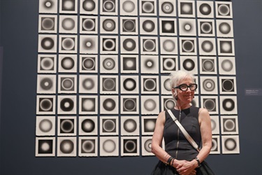 Artist Emma Bingham with her work in RISE