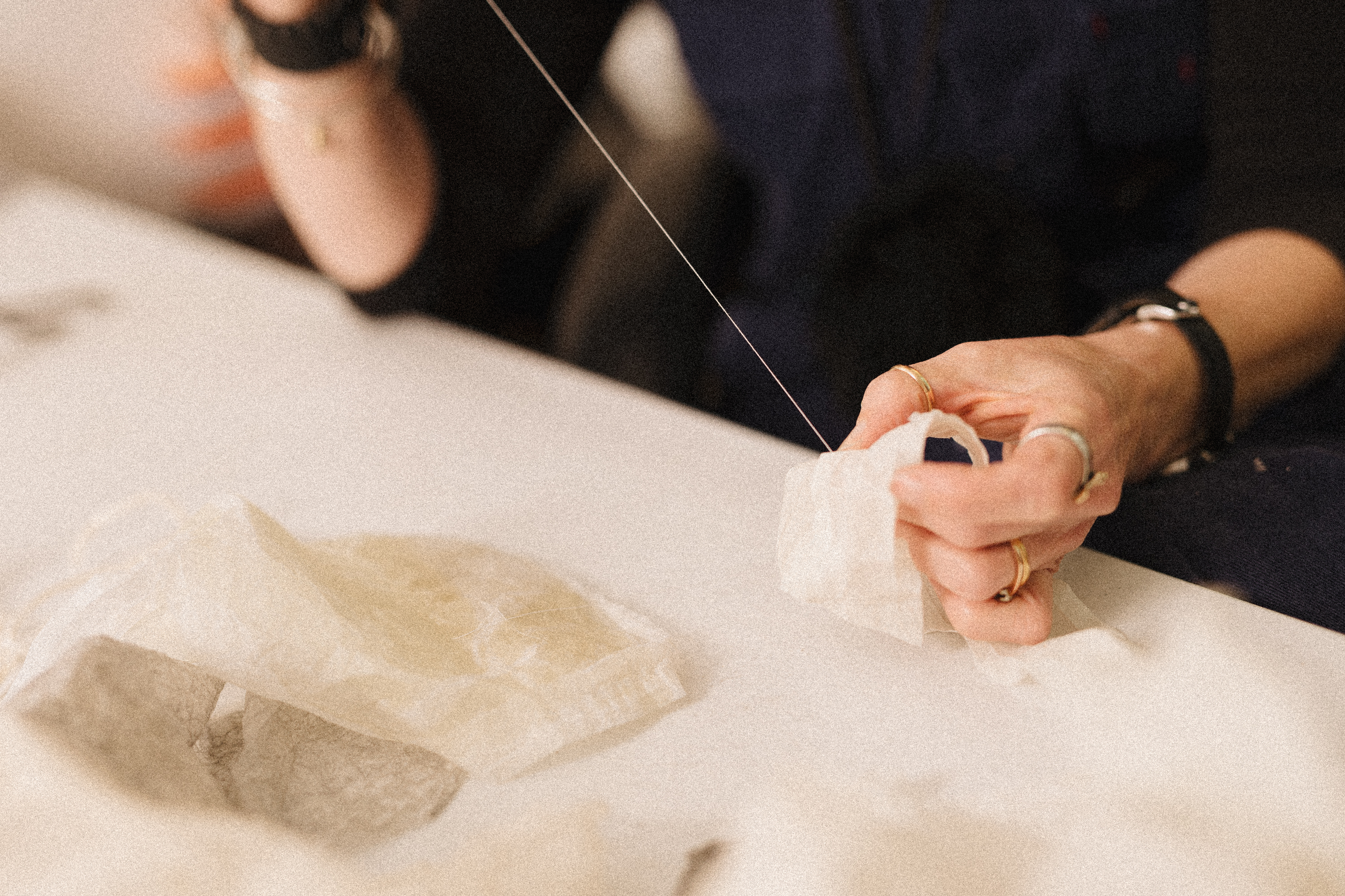 Close up of RISE artist Emma Bingham working with string