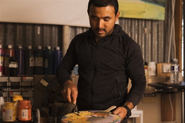 RISE artist Jeewan Suwal in his studio