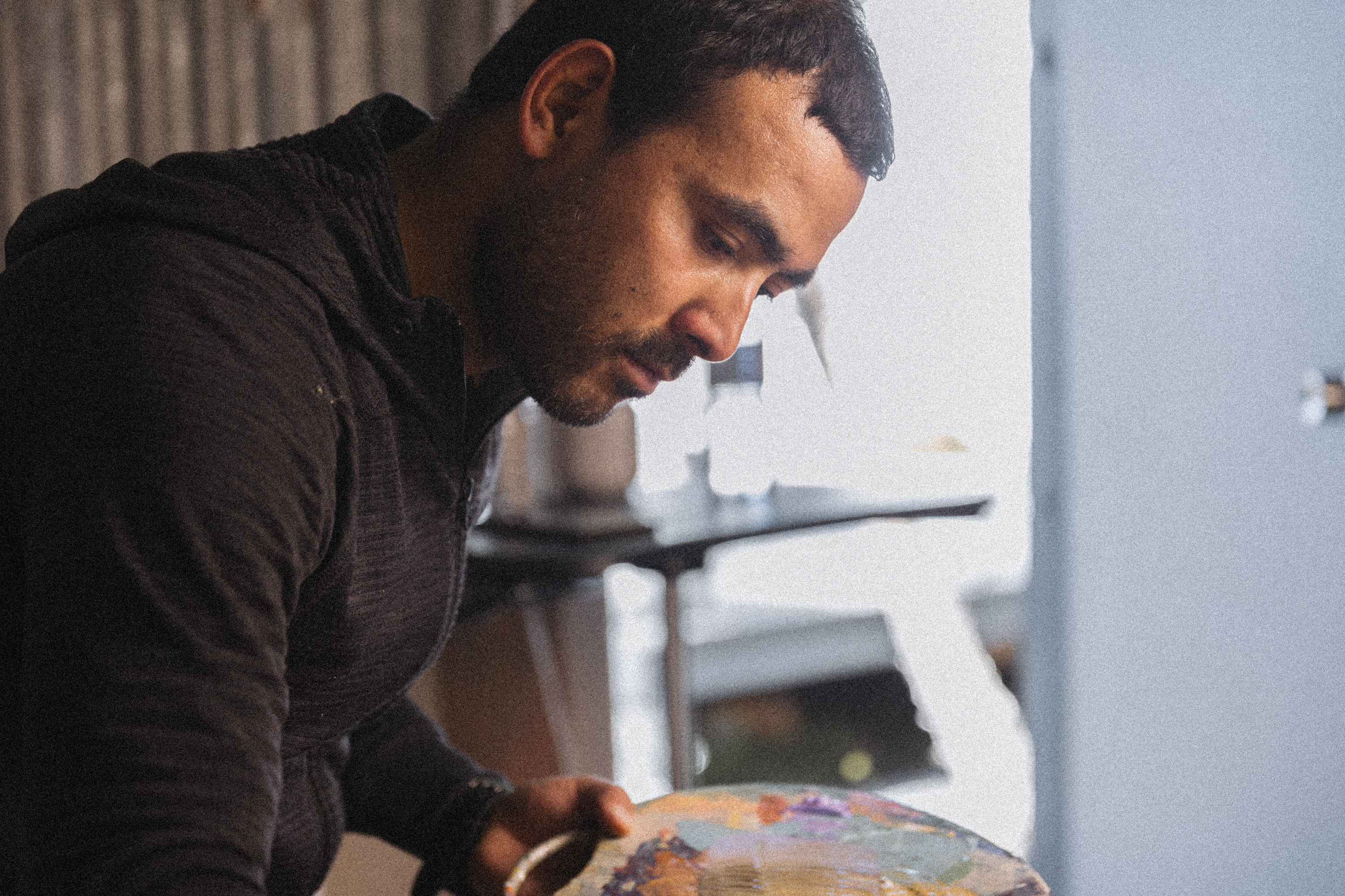 RISE artist Jeewan Suwal works in his Hobart studio