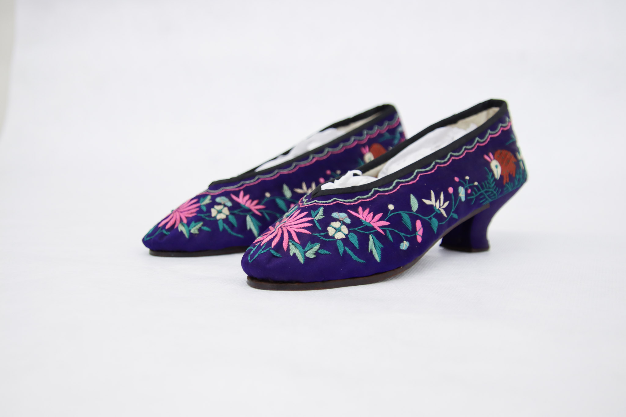 A pair of purple embroidered shoes that belonged to Ann Chung Gon.
