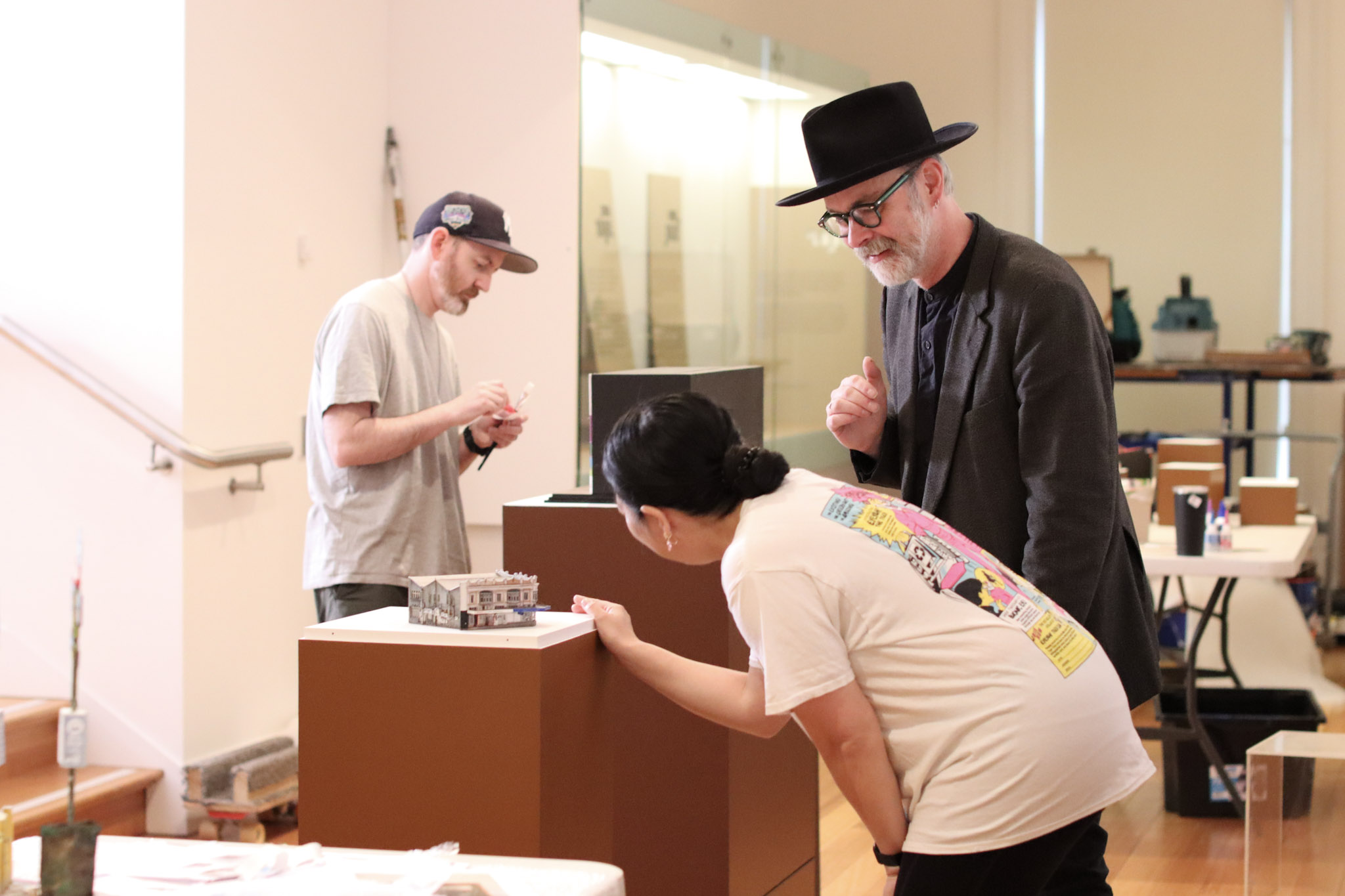 Artist MyLyn Nguyen discusses her miniature sculpture with QVMAG curator Ashley Bird during the bump in for the Miniature Worlds 2023 exhibition.