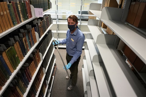 Senior Curator of History, Jon, holding a sword from the QVMAG collection.