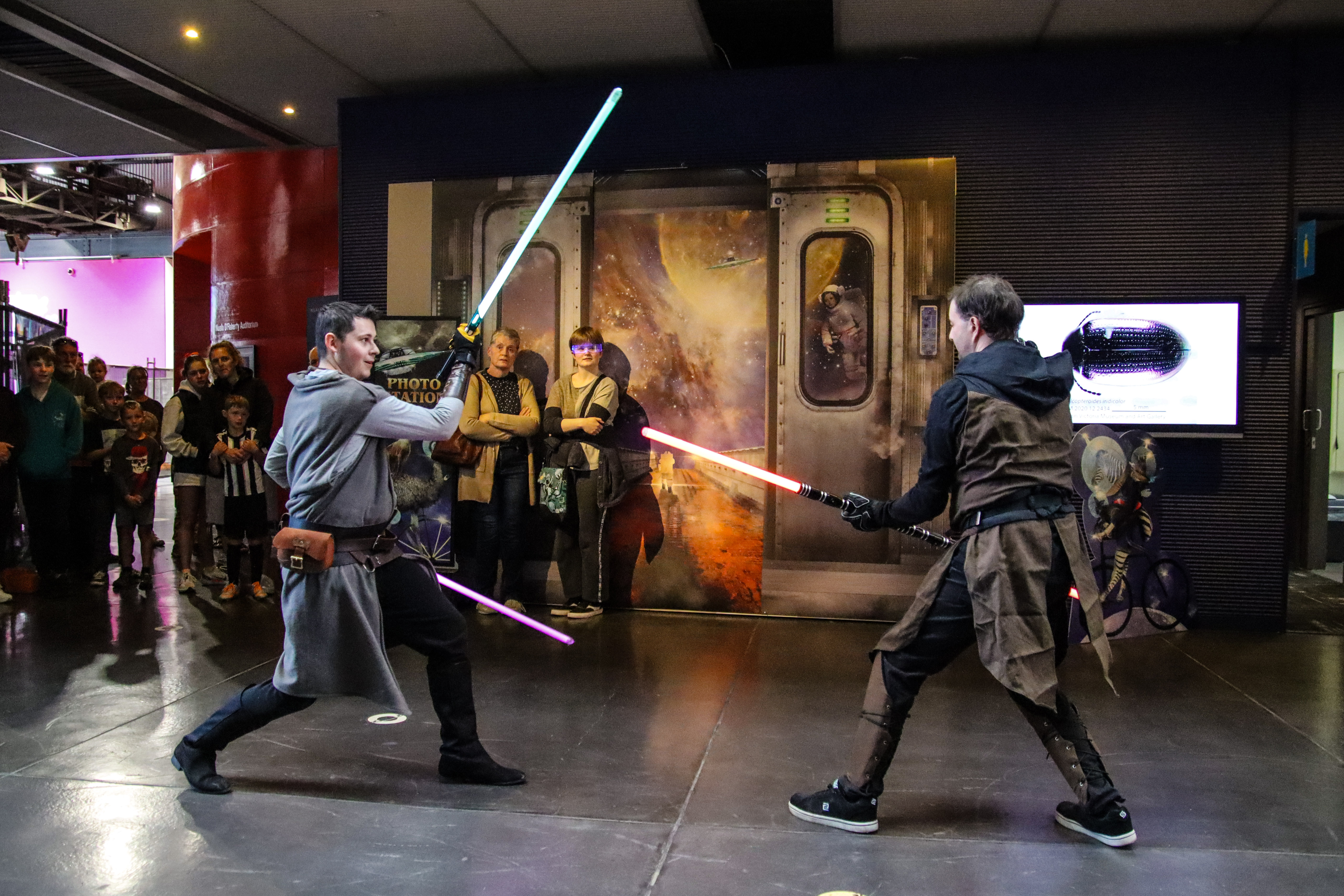 Two members of the Tasmanian Litesabre Alliance in battle at QVMadness 2024