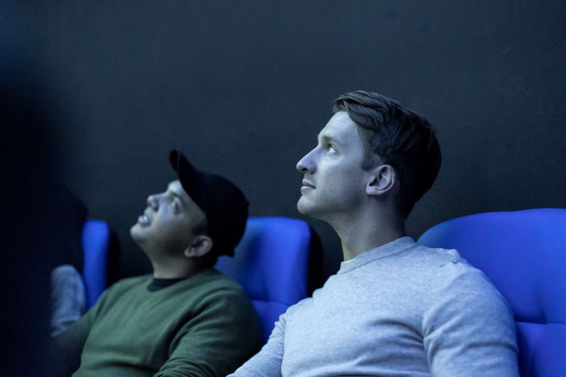 Two people looking up at the dome within the Launceston Planetarium.JPG