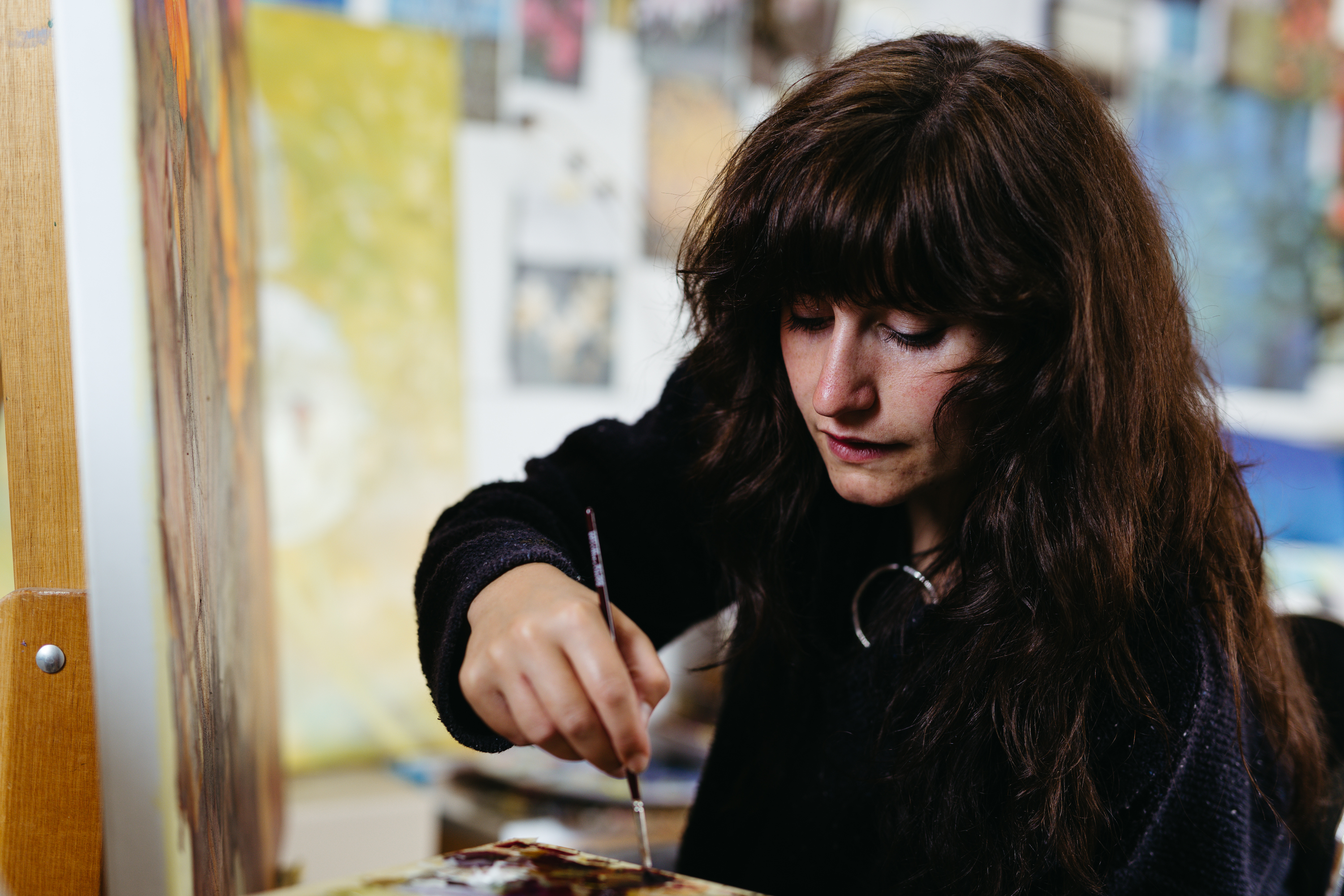 RISE artist Maggie May Jeffries paints in her workshop
